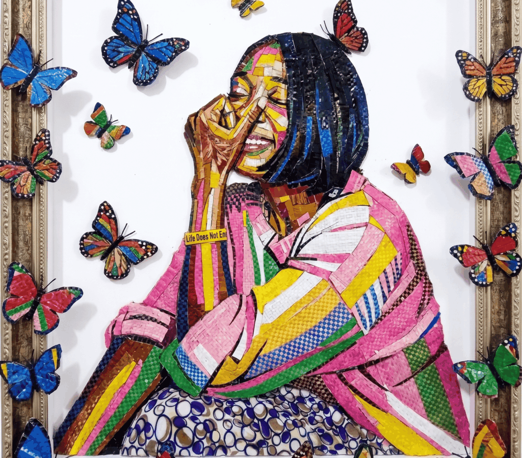 An artistic mosaic portrait titled 'BagCo 2026' created from upcycled polypropylene sacks, featuring a smiling woman surrounded by colorful butterflies made of the same industrial material.