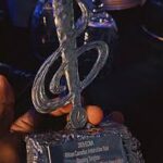 Close-up of the 2024 ECMA African Canadian Artist of the Year trophy awarded to Blessing Tangban by the African Nova Scotian Music Association.